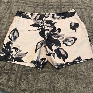 INC flowered shorts. Five inch nails inseam. Two back pockets zippered front.